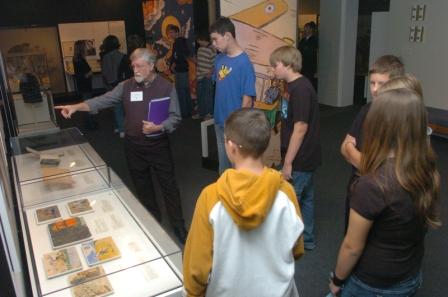 Fig 7: Students view exhibition guided by volunteer docents