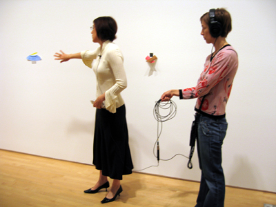 Fig 1: IET producer Tana Johnson, right, trails curator Madeleine Grynsztejn on a staff walk-through of the exhibition The Art of Richard Tuttle, July 2005.